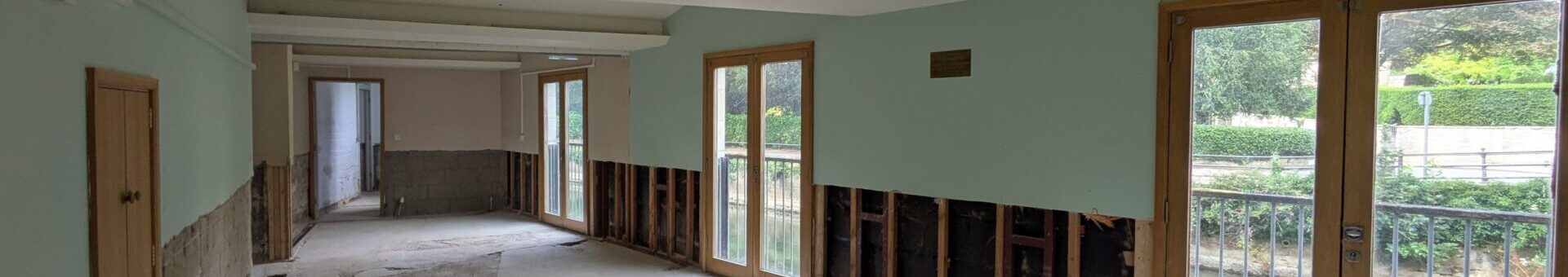 Conference room at St Margaret’s Hall after wall panelling removed during stripping works.